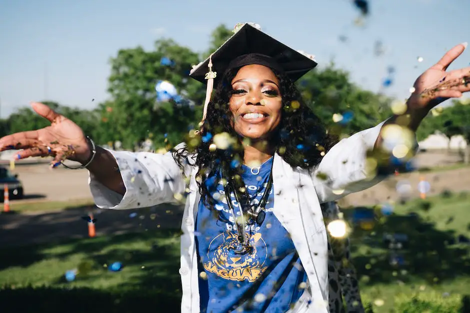 An image of a person holding a graduation cap and smiling with success.